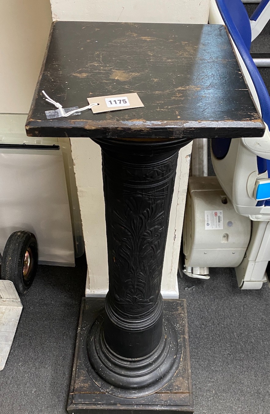 An ebonized and embossed leather covered pedestal, height 114cm.